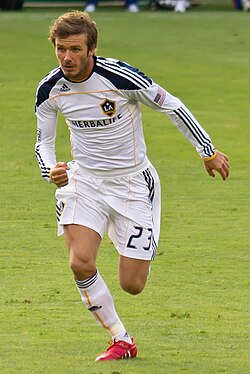 A wide midfielder, David Beckham was lauded for his range of passing, vision, crossing ability and bending free-kicks.[63]