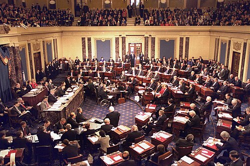 The impeachment trial of United States president Bill Clinton in 1999, Chief Justice William H. Rehnquist presiding. The House managers are seated beside the quarter-circular tables on the left and the president's personal counsel on the right, much in the fashion of United States president Andrew Johnson's trial in 1868.