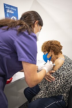An elderly woman receiving a COVID-19 vaccination in Slovakia