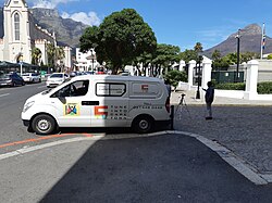 A news van owned by Cape Town TV outside the Houses of Parliament