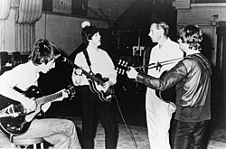 The Beatles rehearsing in the studio with producer George Martin, 1966