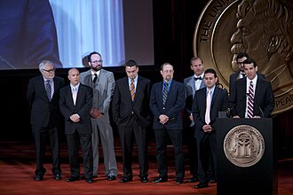 Lee Zurik, joined by WVUE-DT and The Times-Picayune | The New Orleans Advocate, accepts a Peabody Award