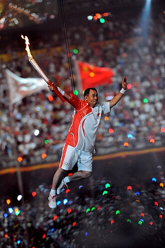 Chinese gymnast Li Ning after igniting the cauldron.