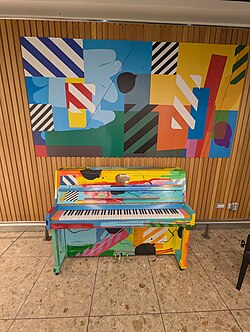 Piano in Terminal 1 of Dublin Airport painted by Al Maser