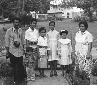 Children dressed in their best for a church festival. The boys are wearing tupenu and ta'ovala.