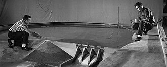 Tennessee Valley Authority civil engineers monitoring hydraulics of a scale model of Tellico Dam