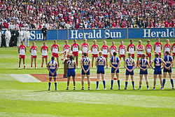 The West Coast Eagles and Sydney Swans line up for the national anthem at the 2005 AFL Grand Final.