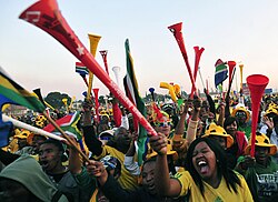 Supporters watching the 2010 FIFA World Cup with vuvuzelas in the township of Soweto, a suburb of Johannesburg