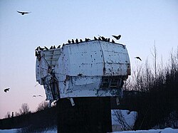 Dilapidated Nike Missile radar dome in Alaska with an evening roost