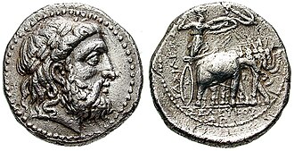 Tetradrachm of Seleucus I from the Seleucia mint. Obverse shows the head of Zeus. Reverse shows Athena with elephants, with Greek legend: BAΣIΛEΩΣ ΣEΛEYKOY, Basileōs Seleukou, "of king Seleucus".