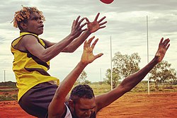 Australian rules football is popular among Indigenous communities.