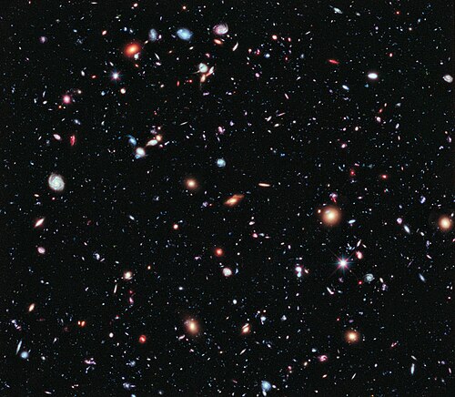 Except for the few stars in the foreground (which are bright and easily recognizable because only they have diffraction spikes), every speck of light in the composite photo is an individual galaxy, some of them as old as 13.2 billion years; the observable universe is estimated to contain more than 2 trillion galaxies.[1] From the Hubble eXtreme Deep Field.