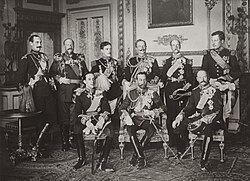 The Nine Sovereigns at Windsor for the funeral of King Edward VII, photographed on 20 May 1910. Standing, from left to right: King Haakon VII of Norway, Tsar Ferdinand I of Bulgaria, King Manuel II of Portugal, Kaiser Wilhelm II of Germany, kings George I of Greece and Albert I of Belgium. Seated, from left to right: kings Alfonso XIII of Spain, George V of the United Kingdom and Frederick VIII of Denmark.