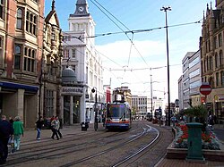 Looking down High Street from near its junction with Fargate, the Star and Telegraph building is on the left.