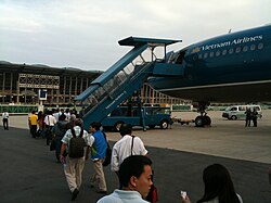 A Vietnam Airlines jet is boarded in front of a terminal of Da Nang International Airport