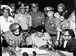 Lt. Gen. A. A. K. Niazi signing the Pakistani Instrument of Surrender in Dhaka on 16 Dec 1971, following India's victory in the 1971 Indo-Pakistani War.