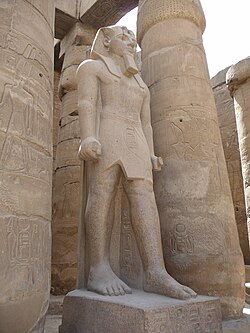 Colossal Statue of Ramesses II in the first peristyle court at Luxor