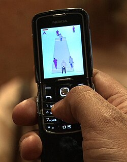 A cricket game being played on a 2007 Nokia 8600 Luna phone