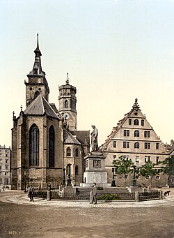 The Protestant Stiftskirche (originally built in 1170, pictured c. 1900) with the memorial on Schillerplatz square in foreground