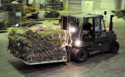 A forklift truck loads a pallet of humanitarian aid to Pakistan on board a C-17 aircraft following devastating floods in the country in August 2010.