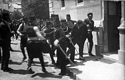 Traditionally thought to show the arrest of Gavrilo Princip (right), this photo is now believed by historians to depict an innocent bystander, Ferdinand Behr, on 28 June 1914.[31][32]