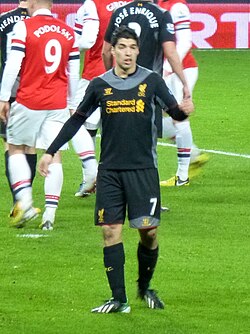 Suárez playing for Liverpool against Arsenal in January 2013
