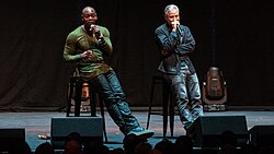 Chappelle with Jon Stewart performing at Royal Albert Hall in 2018