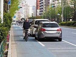 Bike lane separated by parked cars in Hakusan, Japan
