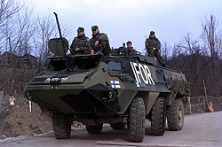 Finnish IFOR troops with their Sisu XA-180 Armored Personnel Carrier