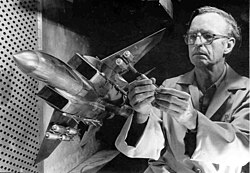 A model of the F-15 Eagle is adjusted before undergoing aerodynamic testing in the mid-1970s in the 4-foot transonic wind tunnel at Arnold Air Force Base, Tennessee
