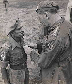 Naik Narayan Sinde, 5th Mahratta Light Infantry, receiving the Indian Distinguished Service Medal from Auchinleck, 1945.