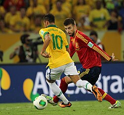 Neymar playing against Spain's Gerard Piqué in the 2013 FIFA Confederations Cup Final