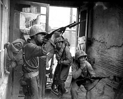 U.S. Marines return fire against North Korean snipers