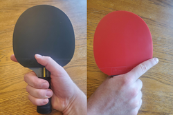 The forehand (black) and backhand (red) views of the Deep Shakehand grip