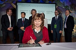 Curran signing the Digital 7 Charter in February 2018
