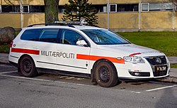 Danish label reading militærpoliti 'military police', on a police vehicle