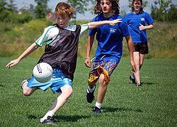 Children participating in a game of Gaelic football
