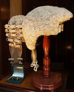 Short wigs as worn in court by advocates (left) and judges (right) in several Commonwealth countries