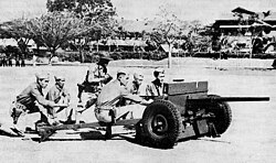 Philippine Scouts at Fort William McKinley firing a 37 mm anti-tank gun in training, circa 1941