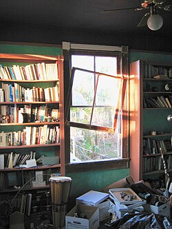 Upstairs library room in home where downstairs flooded Lakeview neighborhood. Hurricane winds blew out window, but left books in shelves