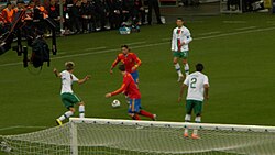 Sergio Ramos of Spain tries to pass the ball to Fernando Torres as Portugal's Fábio Coentrão, Bruno Alves and Cristiano Ronaldo look on.
