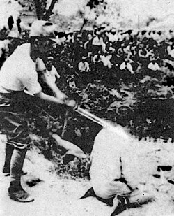 A Chinese POW about to be beheaded by a Japanese officer with a shin gunto