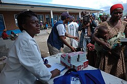 A UNICEF worker is distributing high-calorie food during an emergency situation in Goma, in the Democratic Republic of the Congo, in 2008.