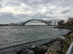Navigational clearance under the Bayonne Bridge in New York harbor was increased to accommodate New Panamax ships by building a new, higher roadway inside the arch and then removing the lower roadway.