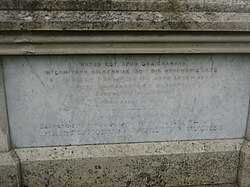 Latin grave inscription in Ireland, 1877; it uses distinctive letters U and J in words like APUD and EJUSDEM, and the digraph Œ in MŒRENTES.