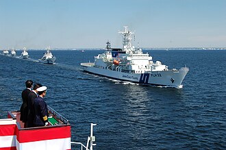 PM Abe and Adm Sato review the JCG fleet in honor of their 70th anniversary in 2018