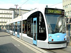 Tram of class Combino in the Hauptbahnhof tram stop in the station