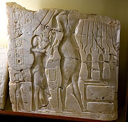 Alabaster sunken relief depicting Akhenaten (head lost), Nefertiti, and daughter Meritaten. Early Aten cartouches on king's arm and chest. From Amarna, Egypt. 18th Dynasty.The Petrie Museum of Egyptian Archaeology, London. With thanks to the Petrie Museum of Egyptian Archaeology, UCL.