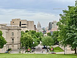 A view of the Wisconsin State Capitol from atop Bascom Hill, including the Wisconsin Historical Society (fore) and Memorial Library (rear) at left.