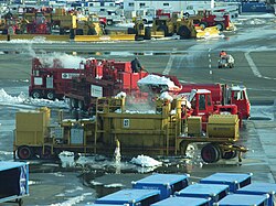Snow melters working at JFK Airport, New York